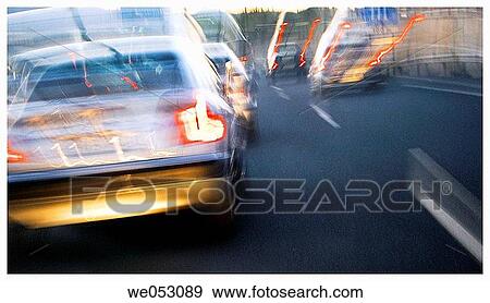 Stock Photo - blurred motion, headlight, day, car, automobile. Fotosearch