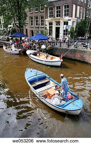 Boat on canal and tourists sitting in street caf?, Egelantiersgracht, Jordaan area, Amsterdam, Holland, Netherlands View Large Photo Image Stock Photograph - Boat on canal and tourists sitting in street caf?, Egelantiersgracht, Jordaan area, Amsterdam, Holland, Netherlands. Fotosearch