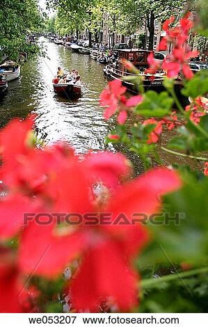 Boat with people on Egelantiersgracht in Amsterdam, Jordaan area, Holland, Netherlands View Large Photo Image Stock Photo - Boat with people on Egelantiersgracht in Amsterdam, Jordaan area, Holland, Netherlands. Fotosearch