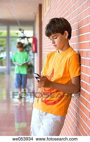 boy, child, cell phone, addiction View Large Photo Image Picture - boy, child, cell phone, addiction. Fotosearch