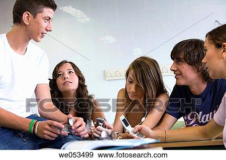 boy, classroom, chat, cell phone, adolescence View Large Photo Image Stock Photo - boy, classroom, chat, cell phone, adolescence. Fotosearch