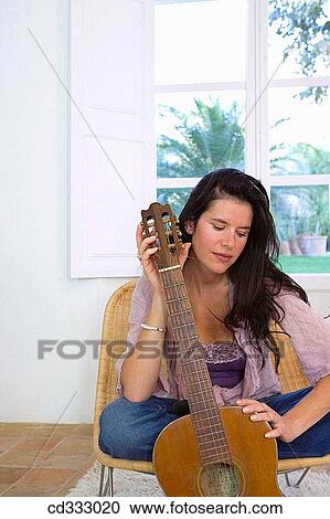 brunette, calm, at-home View Large Photo Image Stock Image - brunette, calm, at-home. Fotosearch