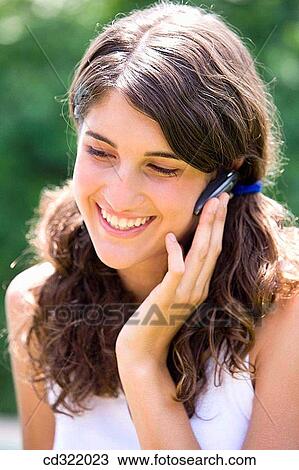 brunette, carefree, cell phone View Large Photo Image Stock Image - brunette, carefree, cell phone. Fotosearch