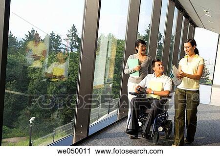 Stock Image - Centro de Investigaci? n Fatronik, Parque Tecnol? gico de San Sebastian, Donostia, Gipuzkoa, Euskadi. Discapacitado-Ejecutivos en oficina. Fotosearch