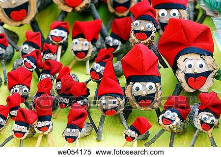Stock Photography - Christmas logs (character relating to a Christmas tradition in Catalonia) for sale at fair. Caga ti?. Fira de Santa Ll·cia, Barcelona, Catalonia, Spain. Fotosearch