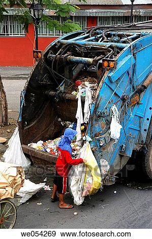 Collecting garbage. Manila. Philippines View Large Photo Image Stock Photo - Collecting garbage. Manila. Philippines. Fotosearch