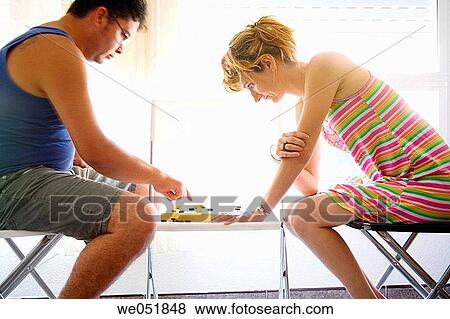 Couple playing checkers View Large Photo Image Stock Photo - Couple playing checkers. Fotosearch