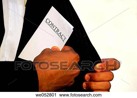 ethnic business man putting contract papers into inside suit jacket View Large Photo Image Stock Image - ethnic business man putting contract papers into inside suit jacket. Fotosearch