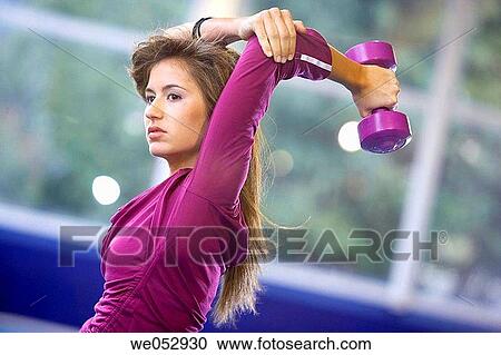 Exercises with dumbbells, gym View Large Photo Image Stock Image - Exercises with dumbbells, gym. Fotosearch