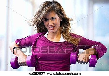 Exercises with dumbbells, gym View Large Photo Image Stock Photo - Exercises with dumbbells, gym. Fotosearch