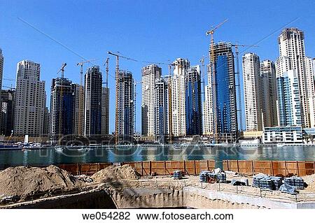 Expansion of the city: ambitious residential projects. Emirate of Dubai. United Arab Emirates on the Persian Gulf. View Large Photo Image Stock Image - Expansion of the city: ambitious residential projects. Emirate of Dubai. United Arab Emirates on the Persian Gulf.. Fotosearch