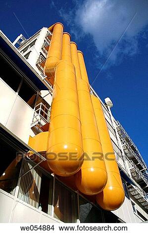 Four orange tubes at frontside of building, Rotterdam, Holland, Netherlands View Large Photo Image Picture - Four orange tubes at frontside of building, Rotterdam, Holland, Netherlands. Fotosearch