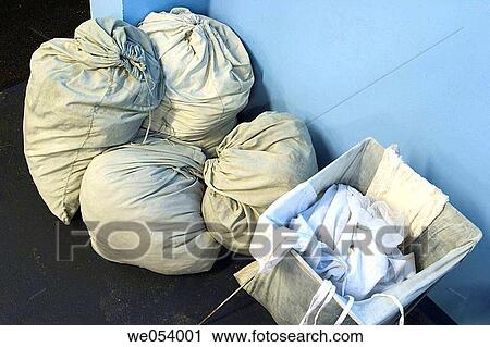 Full laundry bags and basket View Large Photo Image Stock Image - Full laundry bags and basket. Fotosearch