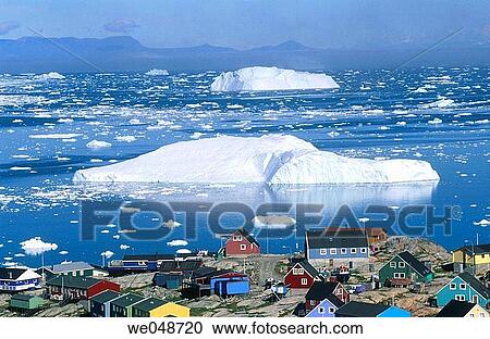 Iceberg. With town Llulissat. Diskobay. Greenland. August. View Large Photo Image Stock Image - Iceberg. With town Llulissat. Diskobay. Greenland. August.. Fotosearch