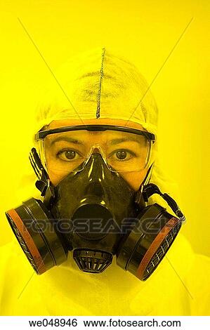 Stock Photograph - Inasmet-Tecnalia Foundation, Technology and Research Centre, San Sebastian Technological Park, Basque Country. Scientist with mask, integrated circuits manufacture, photolithography room, clean room. Fotosearch