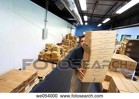 Man, in a warehouse, carrying a stack of cardboard boxes View Large Photo Image Stock Image - Man, in a warehouse, carrying a stack of cardboard boxes. Fotosearch
