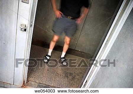 Man standing inside an empty walk-in freezer View Large Photo Image Stock Image - Man standing inside an empty walk-in freezer. Fotosearch