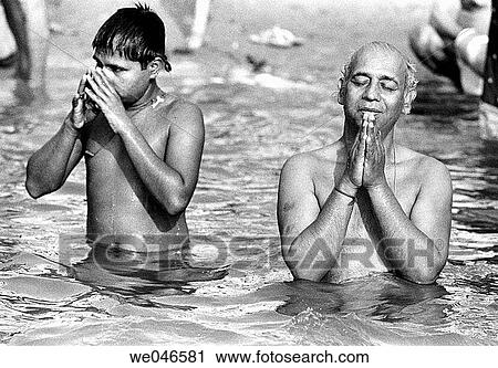 Men praying in Ganges river, Varanasi. Uttar Pradesh, India View Large Photo Image Stock Image - Men praying in Ganges river, Varanasi. Uttar Pradesh, India. Fotosearch