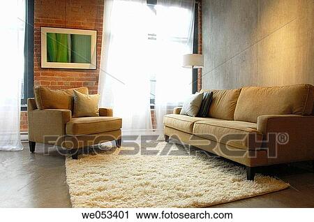 Stock Image - modern loft interior with sofa and chair. Fotosearch