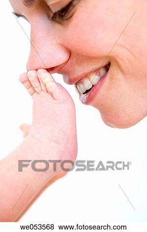Mother Playinf with Baby Foot View Large Photo Image Stock Photo - Mother Playinf with Baby Foot. Fotosearch