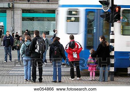 People waiting at traffic light and running tram, Dam square, Amsterdam, Holland View Large Photo Image Stock Photograph - People waiting at traffic light and running tram, Dam square, Amsterdam, Holland. Fotosearch