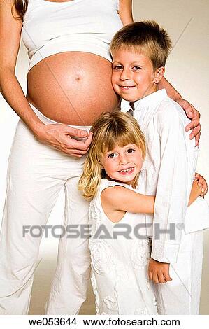 Picture - Pregnant Mother with her Children. Fotosearch