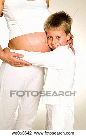 Stock Image - Pregnant Mother with her Children. Fotosearch