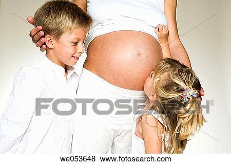 Stock Photo - Pregnant Mother with her Children. Fotosearch