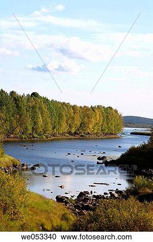 Stock Image - River Torne and landscape in the valley Tornedalen between Haparanda and Pajala. This river forms the border between Sweden and Finland. Norrbotten, Lapland, Sweden, Scandinavia, Europe.. Fotosearch