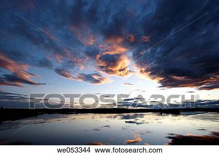 Picture - Sunset colours reflected in the waters of river Torne? lv. Vittangi, Norrbotten, Lapland, Sweden, Scandinavia, Europe. Sub-Arctic. Fotosearch