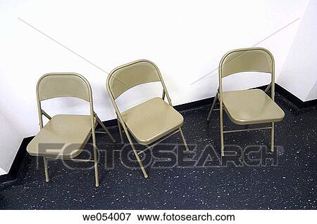 Three open folding chairs View Large Photo Image Stock Photo - Three open folding chairs. Fotosearch