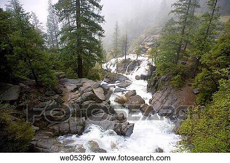 Waterfall with a fog background in Yosemite National Park. California. USA View Large Photo Image Stock Photo - Waterfall with a fog background in Yosemite National Park. California. USA. Fotosearch