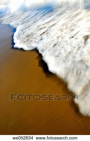 white wave rolling onto sandy beach View Large Photo Image Picture - white wave rolling onto sandy beach. Fotosearch