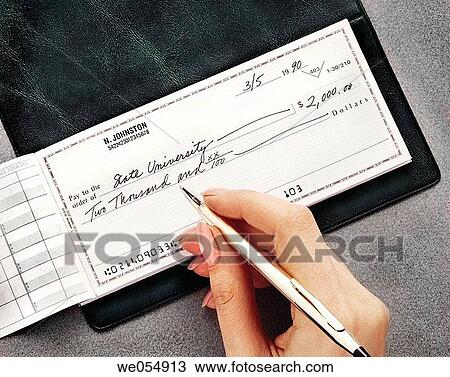 Woman writing a check as payment for college View Large Photo Image Stock Image - Woman writing a check as payment for college. Fotosearch