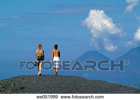 Women walking, Aeolian Islands. Italy View Large Photo Image Stock Photo - Women walking, Aeolian Islands. Italy. Fotosearch