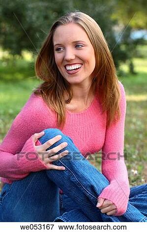 Young blonde woman in the park. Laughing off camera. View Large Photo Image Stock Photo - Young blonde woman in the park. Laughing off camera.. Fotosearch