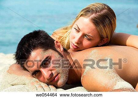 Picture - 30's, beach, affection, absorbed, 20's. Fotosearch