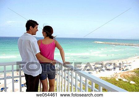 Stock Image - 30's, beach, balcony, affection, 20's. Fotosearch