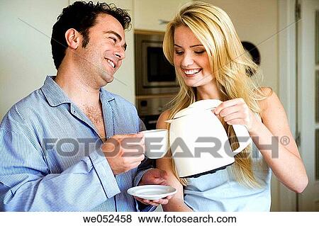 Stock Photo - 30's, bond, at-home, affection, 20's. Fotosearch