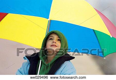 7 year old boy under an umbrella View Large Photo Image Stock Photograph - 7 year old boy under an umbrella. Fotosearch