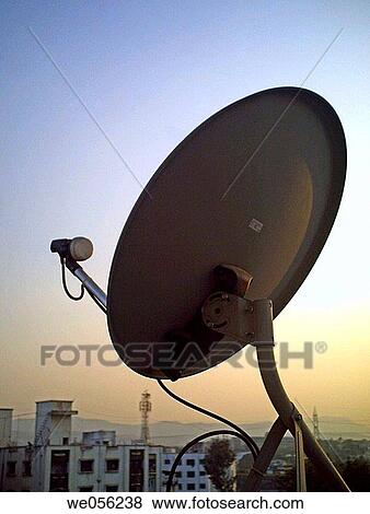 A dish antena of a television set on a building terrace Pune, Maharashtra, India View Large Photo Image Stock Photo - A dish antena of a television set on a building terrace Pune, Maharashtra, India. Fotosearch