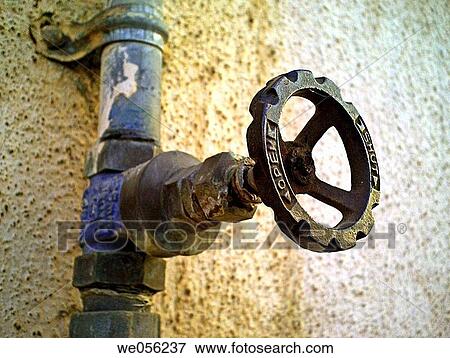 A revolving cock, tap of a water pipeline going to an overhead water storage on a building teracce Pune, Maharashtra, India View Large Photo Image Stock Photo - A revolving cock, tap of a water pipeline going to an overhead water storage on a building teracce Pune, Maharashtra, India. Fotosearch