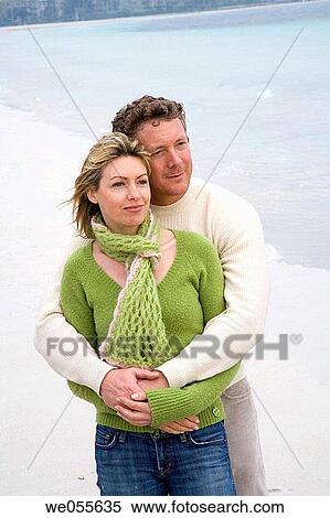 absorbed, beach, autumn, affection, 30's View Large Photo Image Stock Photography - absorbed, beach, autumn, affection, 30's. Fotosearch