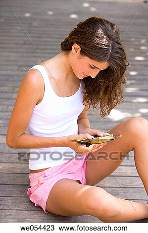Stock Image - addiction, brunette, adolescence, 20's. Fotosearch