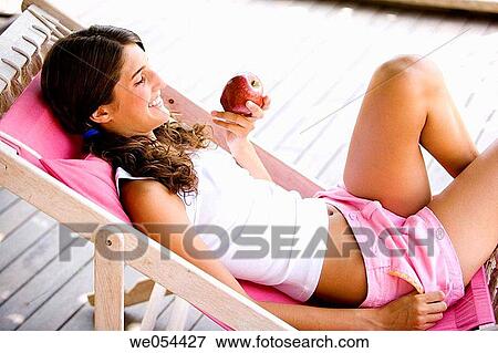 adolescence, calm, brunette, apple, 20's View Large Photo Image Stock Photo - adolescence, calm, brunette, apple, 20's. Fotosearch
