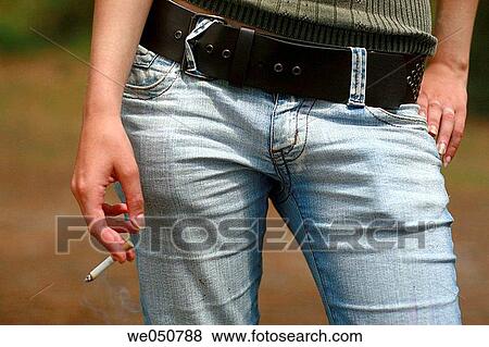 adolescence, cigarette, belt, addiction View Large Photo Image Stock Photo - adolescence, cigarette, belt, addiction. Fotosearch
