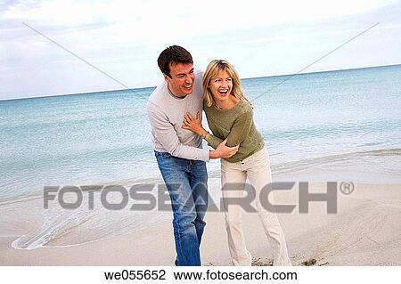 affection, beach, autumn, amusement, 30's View Large Photo Image Stock Image - affection, beach, autumn, amusement, 30's. Fotosearch