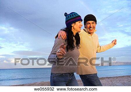 Stock Image - affection, beach, autumn, amusement, 30's. Fotosearch