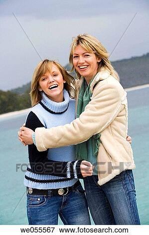 Stock Photo - affection, beach, autumn, amusement, 30's. Fotosearch