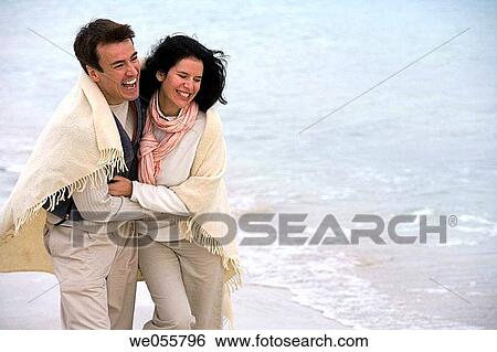 Stock Photograph - affection, beach, autumn, amusement, 30's. Fotosearch